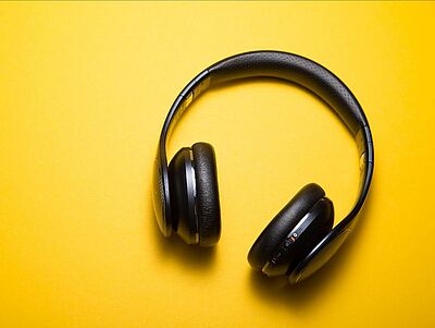 headphones on a bright yellow background