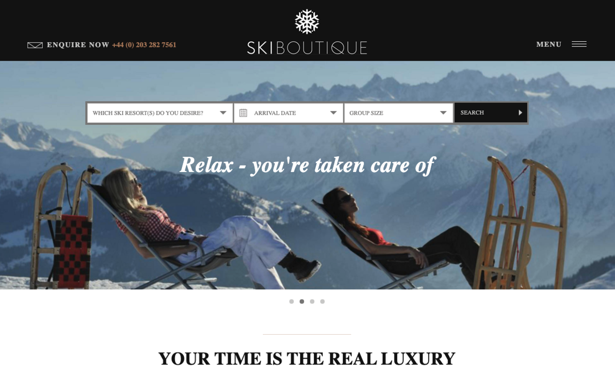 screenshot of Ski Boutique website two people sitting outside surrounded by snowy mountains 