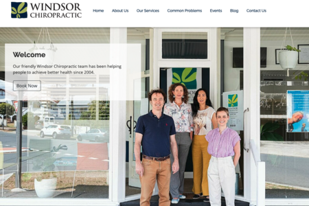 screenshot of Windsor Chiropractic website with team photo in front of office.